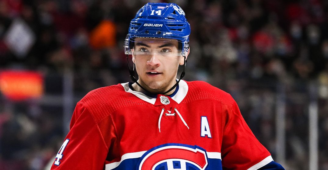 Nick Suzuki hoisting the Stanley Cup